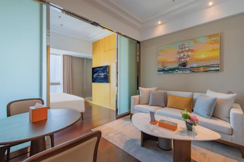 Imagen de la habitación del Hotel Hengli Dalian. Foto 19