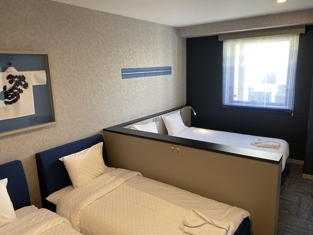 Imagen de la habitación del Hotel Henn Na Fukuoka Hakata. Foto 13