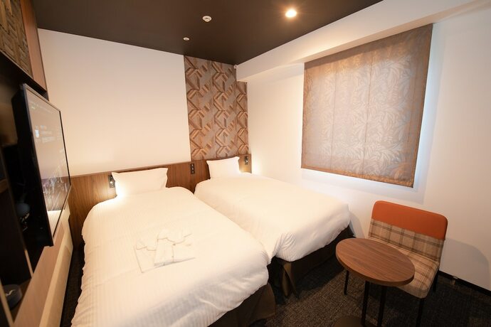 Imagen de la habitación del Hotel Henn Na Tokyo Akasaka. Foto 13