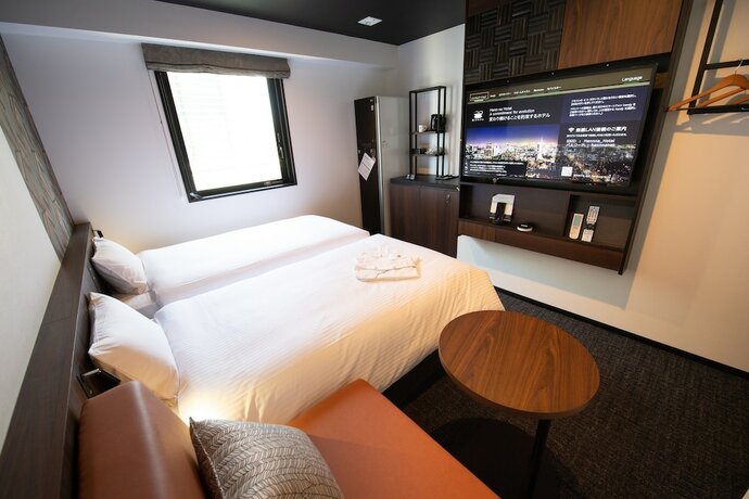 Imagen de la habitación del Hotel Henn Na Tokyo Akasaka. Foto 18