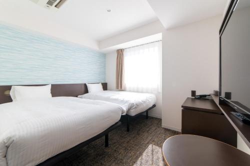 Imagen de la habitación del Hotel Henn na Hotel Express Osaka Namba Nipponbashi Annex. Foto 3