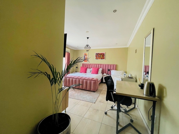 Imagen de la habitación del Hotel Henry George Guest House. Foto 1