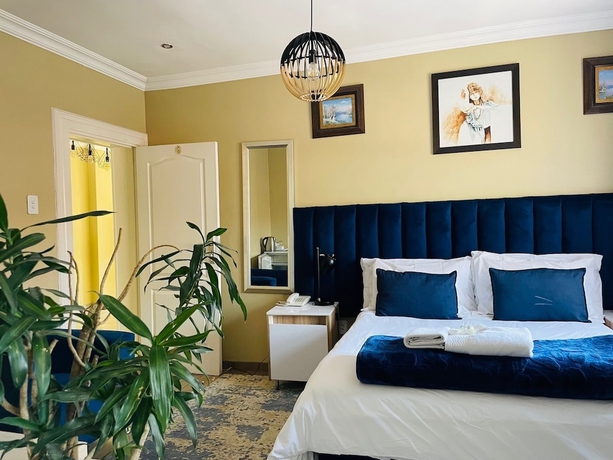 Imagen de la habitación del Hotel Henry George Guest House. Foto 2