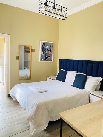 Imagen de la habitación del Hotel Henry George Guest House. Foto 5