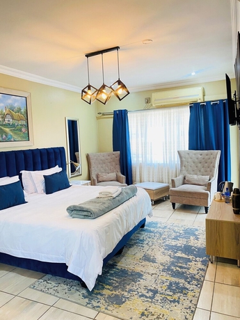 Imagen de la habitación del Hotel Henry George Guest House. Foto 8