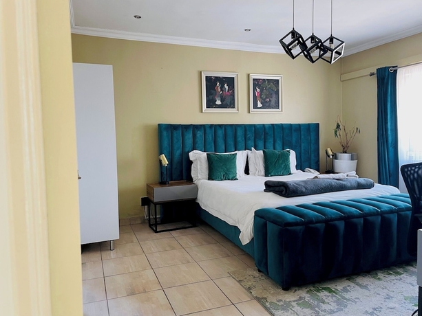 Imagen de la habitación del Hotel Henry George Guest House. Foto 13