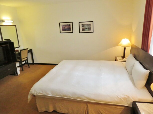 Imagen de la habitación del Hotel Herkang. Foto 11