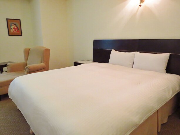 Imagen de la habitación del Hotel Herkang. Foto 14