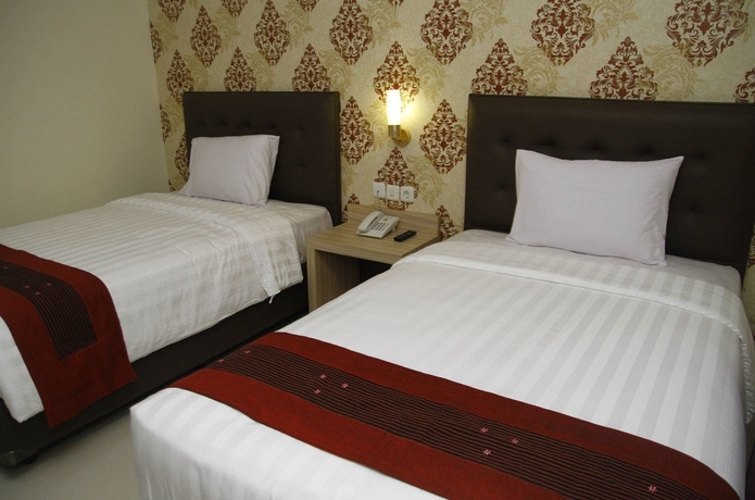 Imagen de la habitación del Hotel Hersya Front One Inn Surabaya. Foto 2