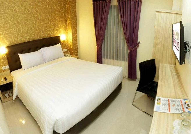 Imagen de la habitación del Hotel Hersya Front One Inn Surabaya. Foto 3