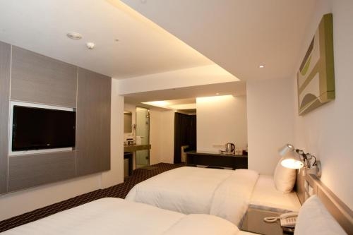 Imagen de la habitación del Hotel Hi - Xinmin. Foto 8