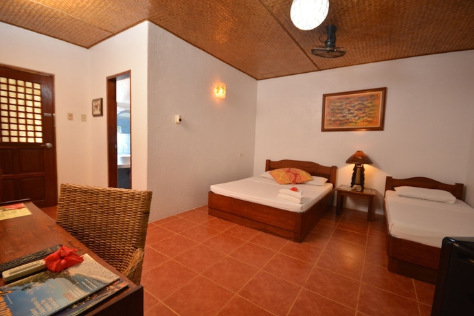 Imagen de la habitación del Hotel Hibiscus Garden Inn. Foto 7