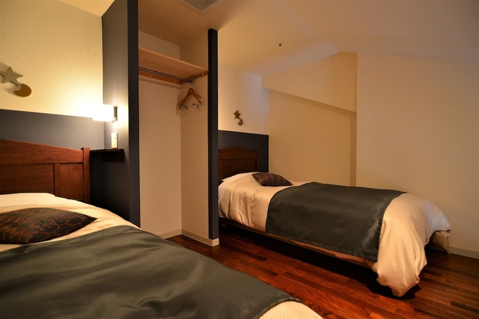 Imagen de la habitación del Hotel Higashikawa Asahidake Onsen Bear Monte. Foto 14