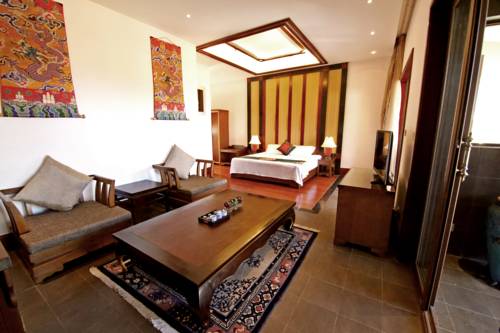 Imagen de la habitación del Hotel High Mountain Resort-deqin. Foto 1