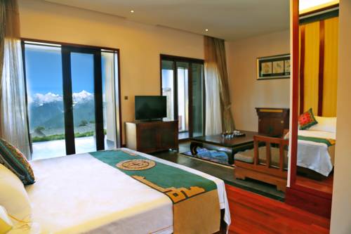 Imagen de la habitación del Hotel High Mountain Resort-deqin. Foto 2