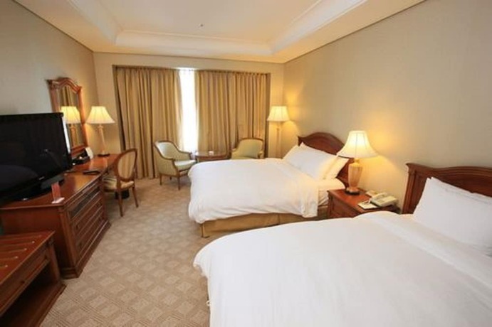 Imagen de la habitación del Hotel High1 Grand Main Tower. Foto 11