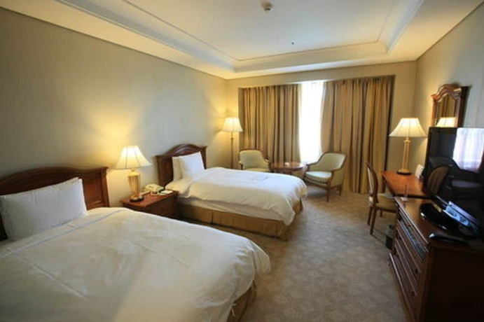 Imagen de la habitación del Hotel High1 Grand Main Tower. Foto 12