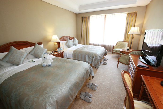 Imagen de la habitación del Hotel High1 Grand Main Tower. Foto 17