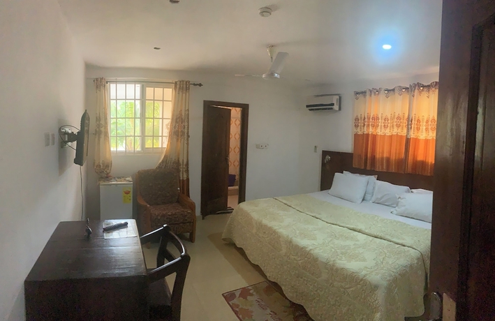 Imagen de la habitación del Hotel HighLander Guest House. Foto 6