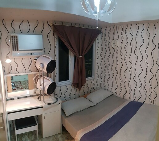 Imagen de la habitación del Hotel High-Tech Studio at Grass Residences. Foto 33