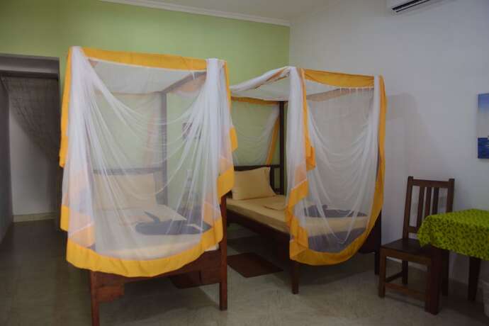 Imagen de la habitación del Hotel Highland Bungalows. Foto 11