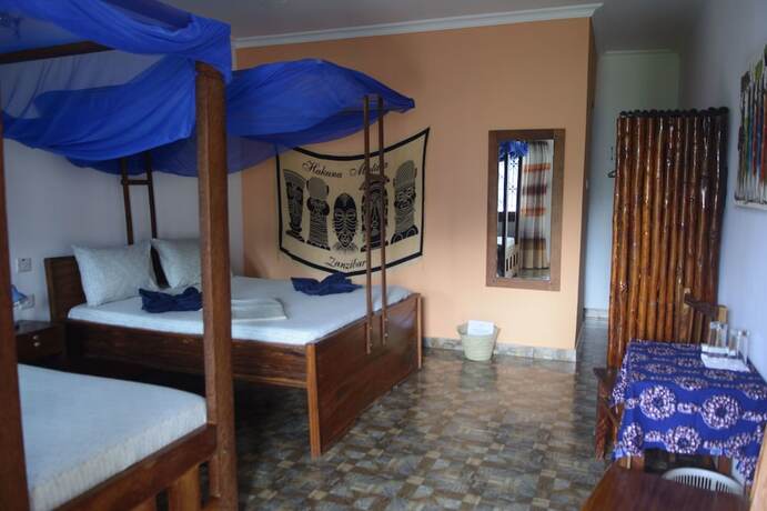 Imagen de la habitación del Hotel Highland Bungalows. Foto 13