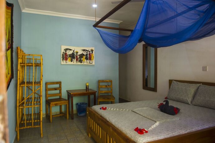 Imagen de la habitación del Hotel Highland Bungalows. Foto 16