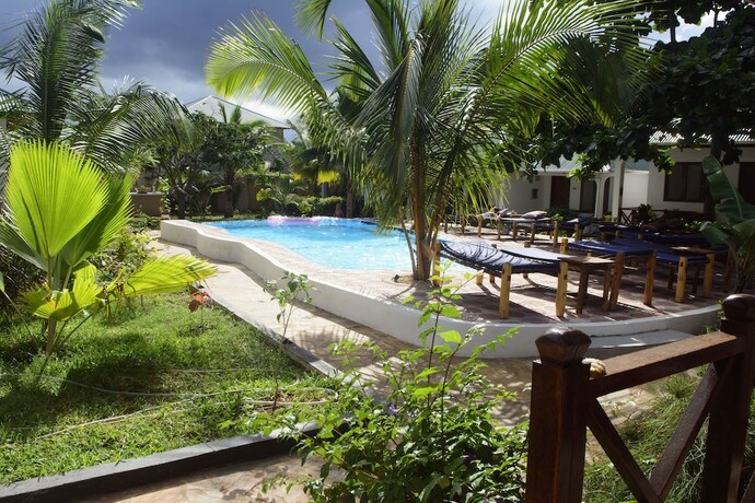 Imagen de la habitación del Hotel Highland Bungalows. Foto 19
