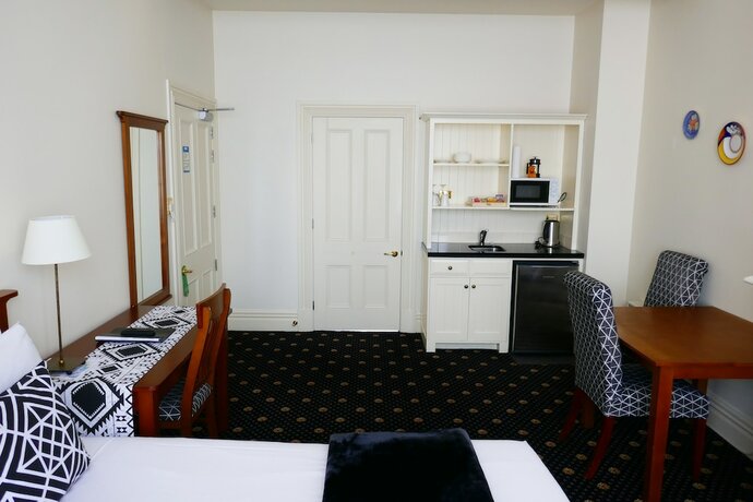 Imagen de la habitación del Hotel Highland House Boutique. Foto 15