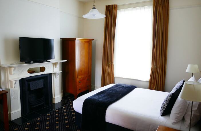 Imagen de la habitación del Hotel Highland House Boutique. Foto 17