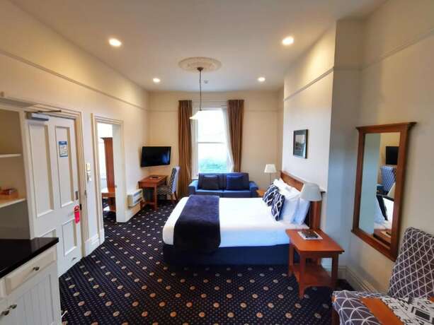 Imagen de la habitación del Hotel Highland House Boutique. Foto 22