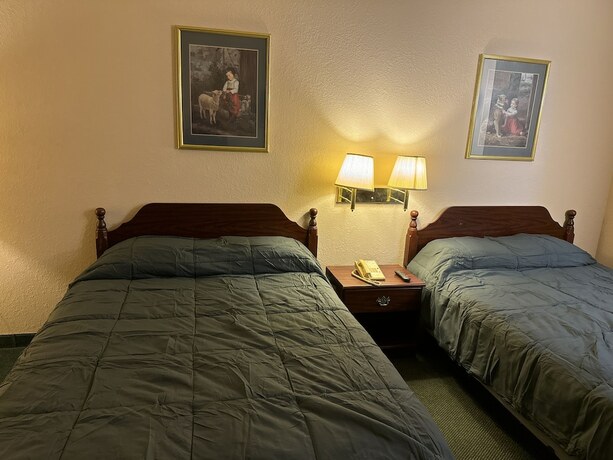 Imagen de la habitación del Hotel Highland Inn Peculiar. Foto 18