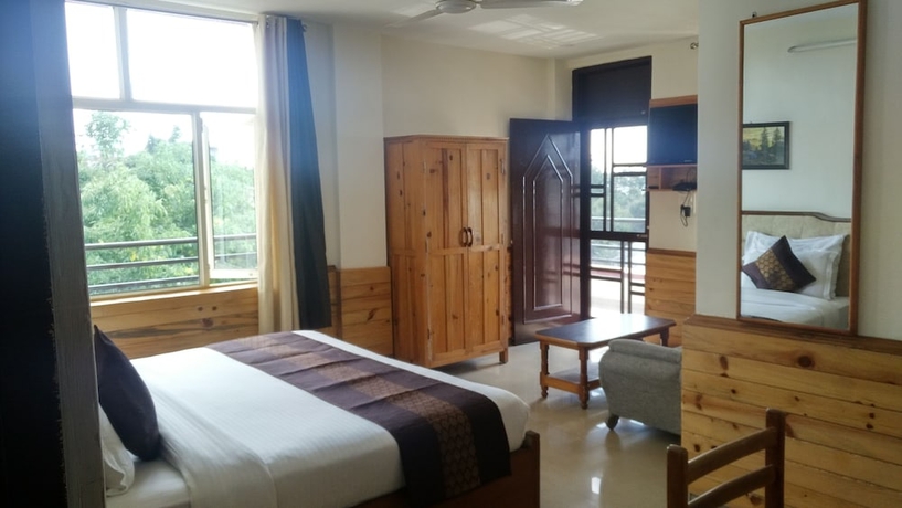 Imagen de la habitación del Hotel Highland Village Resort. Foto 3