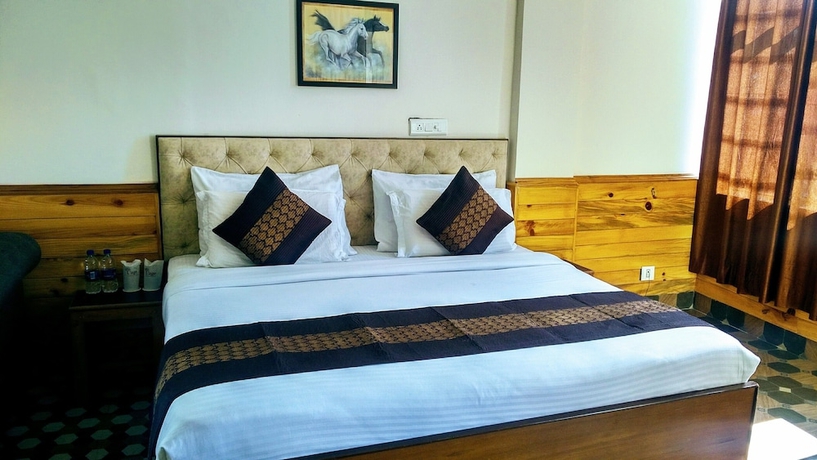 Imagen de la habitación del Hotel Highland Village Resort. Foto 12