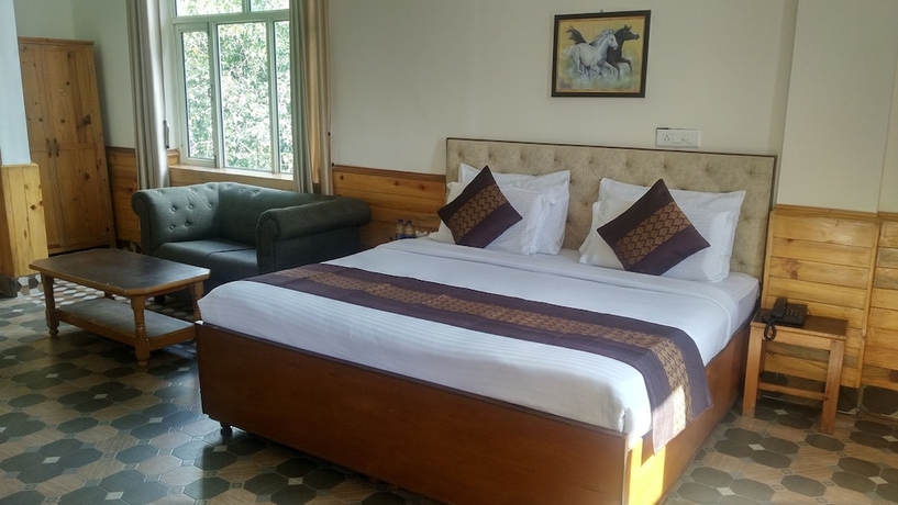 Imagen de la habitación del Hotel Highland Village Resort. Foto 13