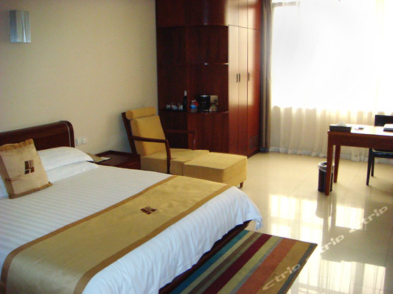 Imagen de la habitación del Hotel Highsure All Suite. Foto 7