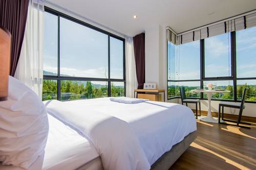 Imagen de la habitación del Hotel Hill Myna Condotel. Foto 11