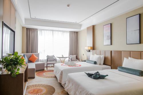 Imagen de la habitación del Hotel Hilmanhomeful - Caijia Subway Station. Foto 17