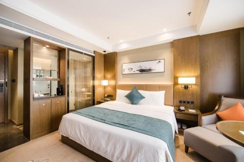 Imagen de la habitación del Hotel Hilmanhomeful - Caijia Subway Station. Foto 18