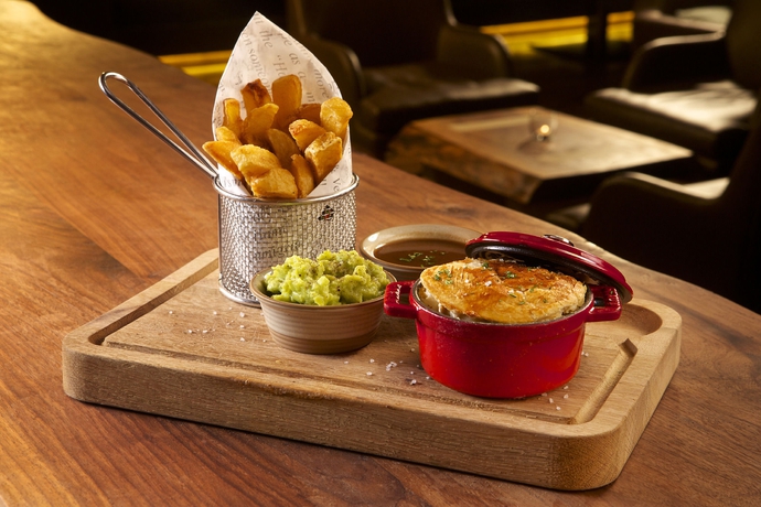 Imagen del bar/restaurante del Hotel Hilton Al Hamra Beach & Golf Resort. Foto 2