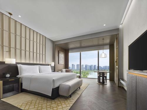 Imagen de la habitación del Hotel Hilton Changshu. Foto 18