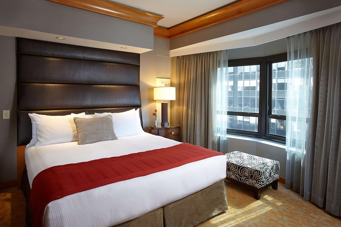 Imagen de la habitación del Hotel Hilton Club New York. Foto 11