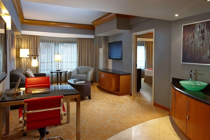 Imagen de la habitación del Hotel Hilton Club New York. Foto 13