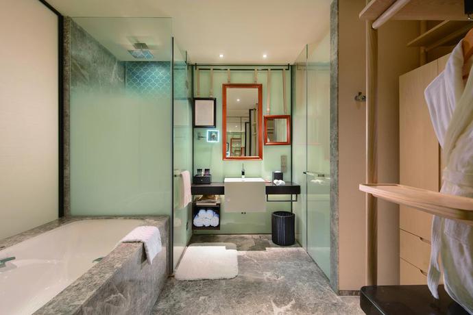 Imagen de la habitación del Hotel Hilton Dalian Golden Pebble Beach Resort. Foto 7