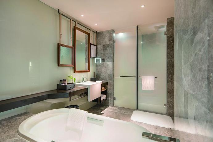 Imagen de la habitación del Hotel Hilton Dalian Golden Pebble Beach Resort. Foto 13
