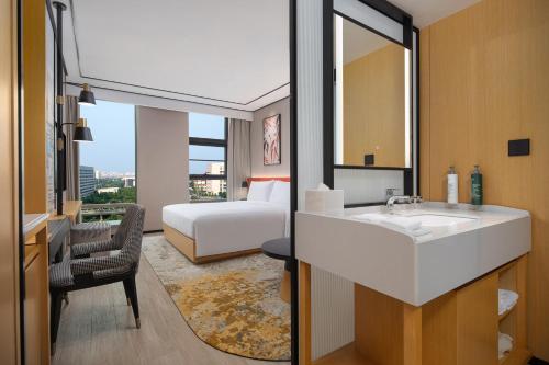 Imagen de la habitación del Hotel Hilton Garden Inn Beijing Huaxiang Tiantan Hospital. Foto 4