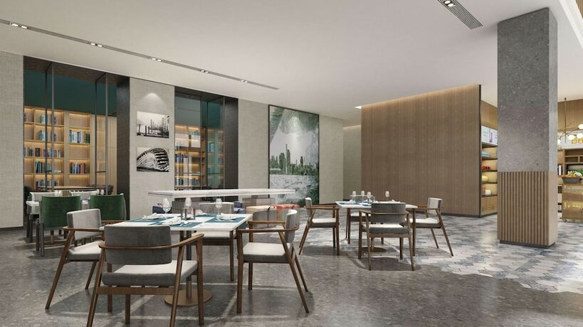 Imagen del bar/restaurante del Hotel Hilton Garden Inn Changchun Economic Development Zone. Foto 5
