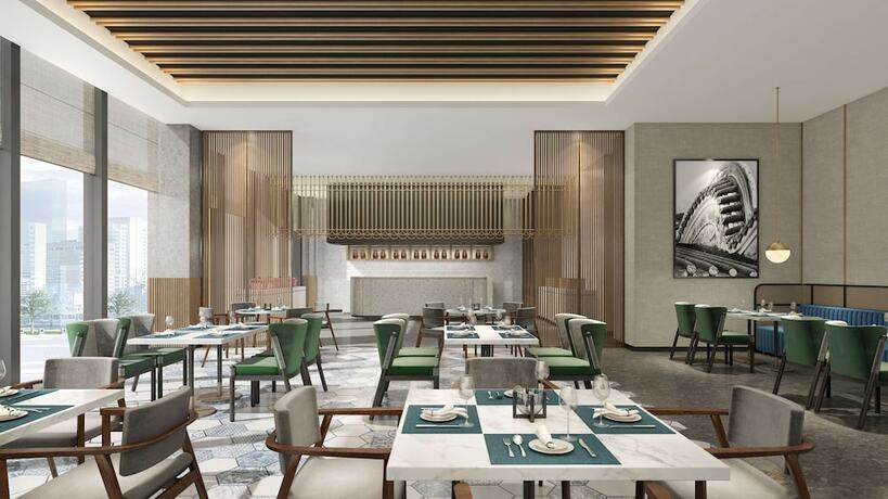 Imagen del bar/restaurante del Hotel Hilton Garden Inn Changchun Economic Development Zone. Foto 6