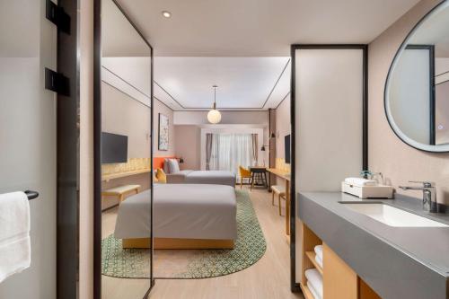 Imagen de la habitación del Hotel Hilton Garden Inn Guangzhou Airport Aerotropolis - Free shuttle to Airport. Foto 11
