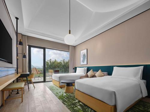 Imagen de la habitación del Hotel Hilton Garden Inn Guilin Yangshuo. Foto 13